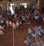 Volunteers educating the participants in language-specific break-out groups